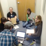 James, Katie, Sarah, Zach, and Stephen brainstorming.