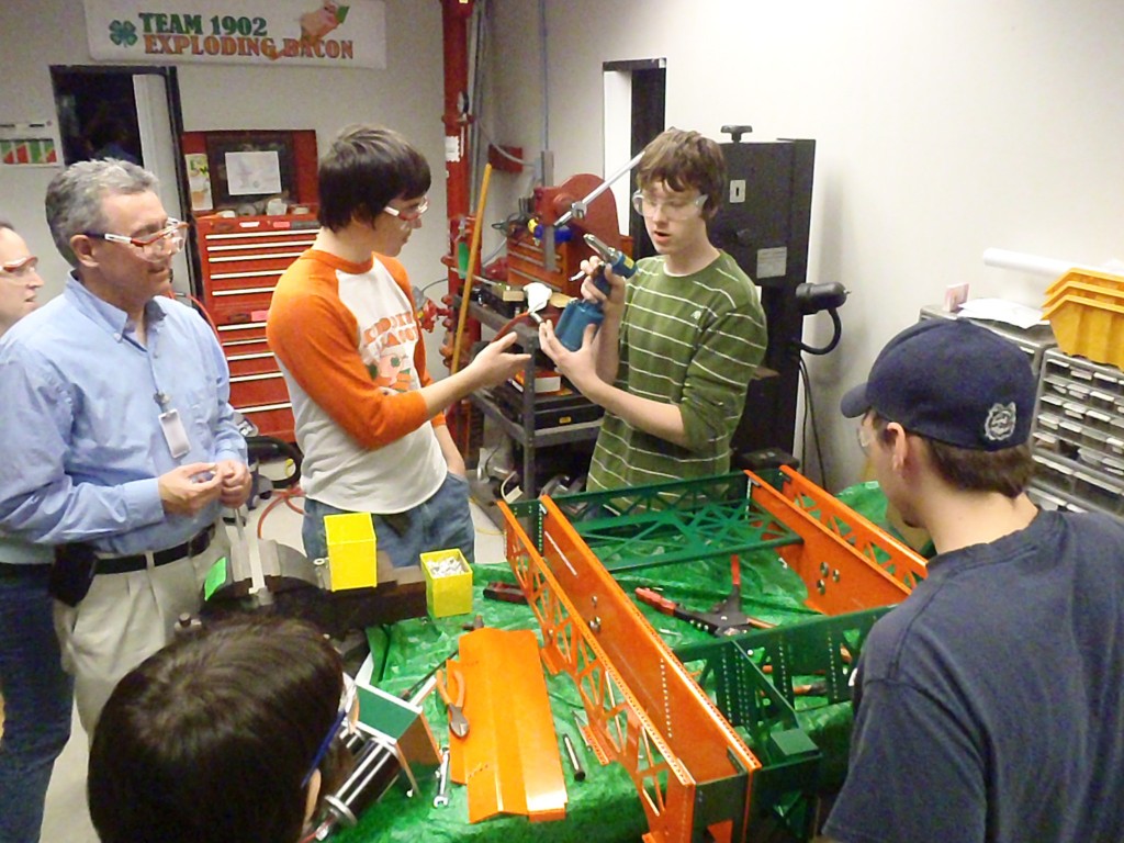 Everyone gets to help rivet the robot.  Even the Mentors and parents get to put a few rivets on.