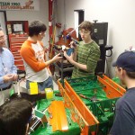 Everyone gets to help rivet the robot.  Even the Mentors and parents get to put a few rivets on.