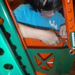 Phillip bolting the robot drive-train.