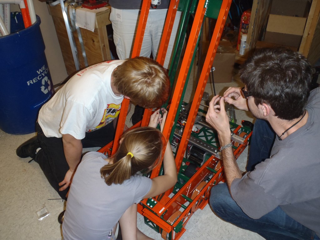 Brendan, Katie and Kris working to get the chain just right.